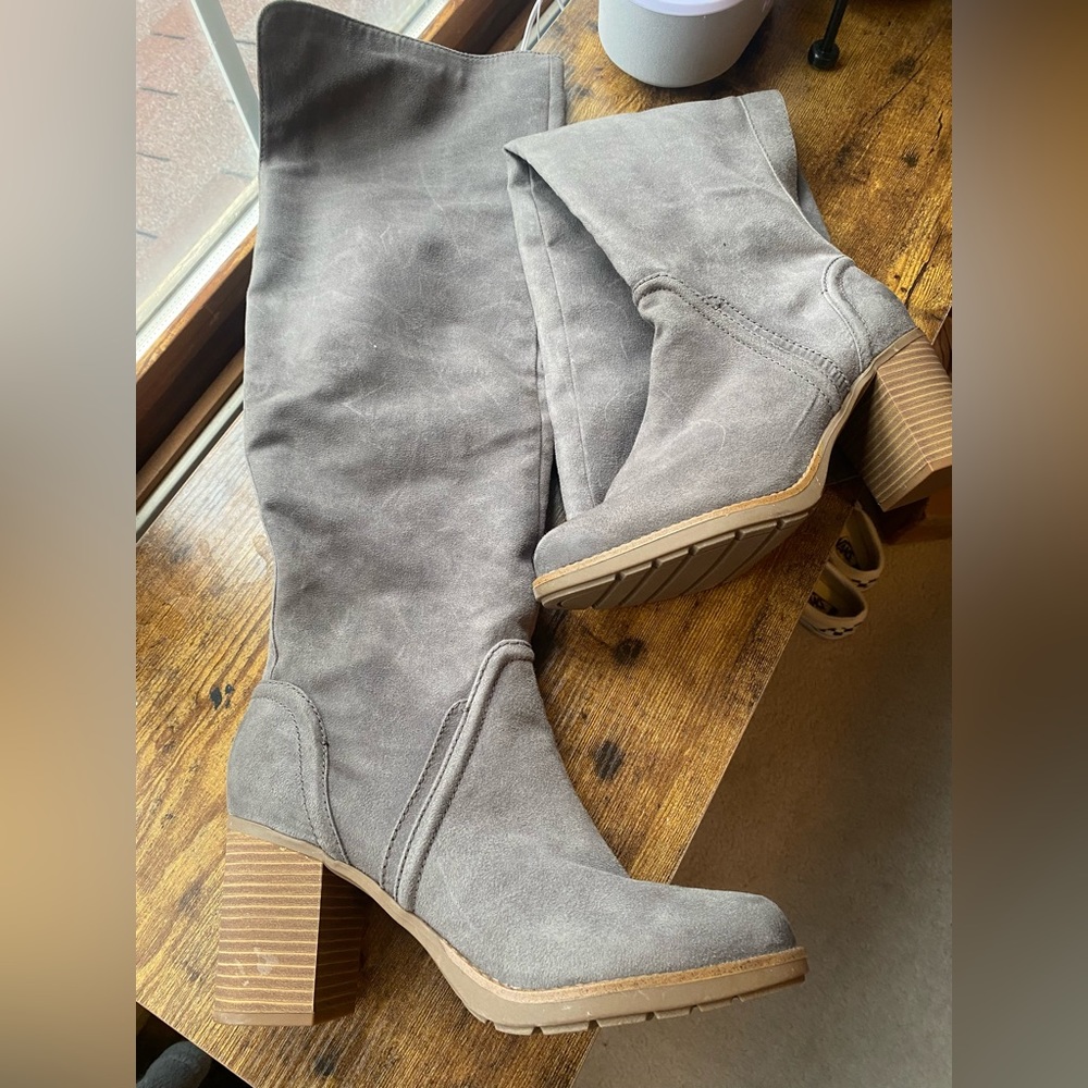 Gray knee high heeled boots